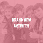 Five young people huddle together for a photo, some are giving thumbs up.